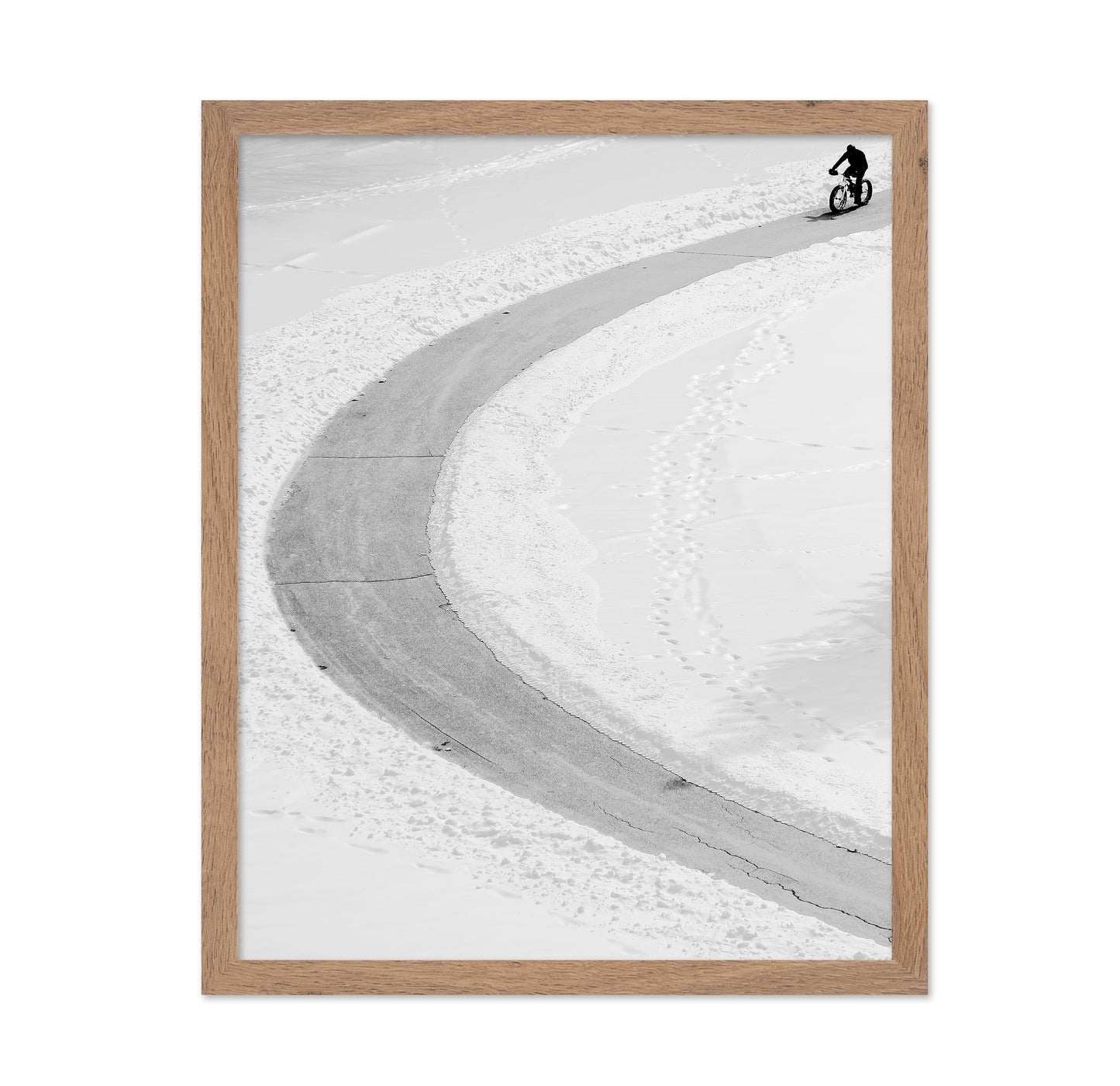 Lone Cyclist in Snow