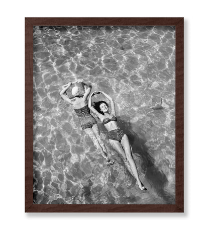 Swimsuit Models Float in Water