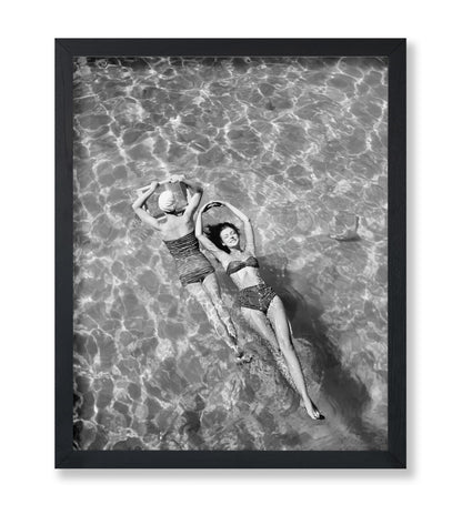 Swimsuit Models Float in Water