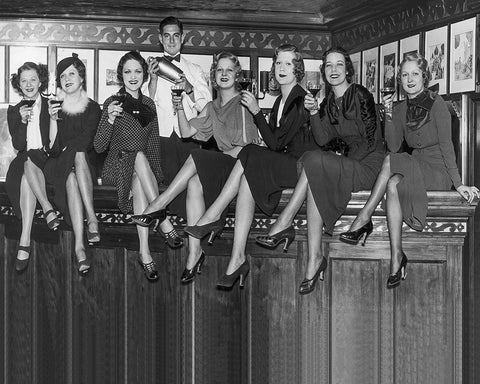 Women Sitting on A Bar