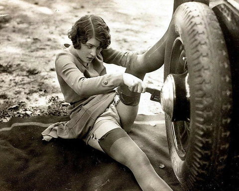 Woman Changing Tires