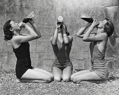 Women Drinking Wine From Bottle in Swimsuits