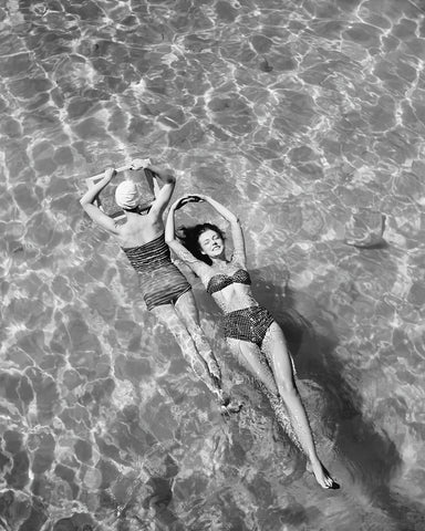 Swimsuit Models Float in Water