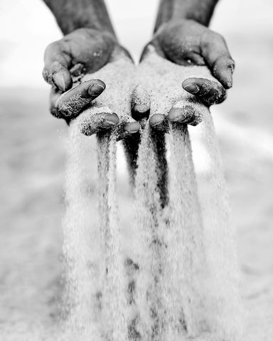 Sand Slipping Through Fingers