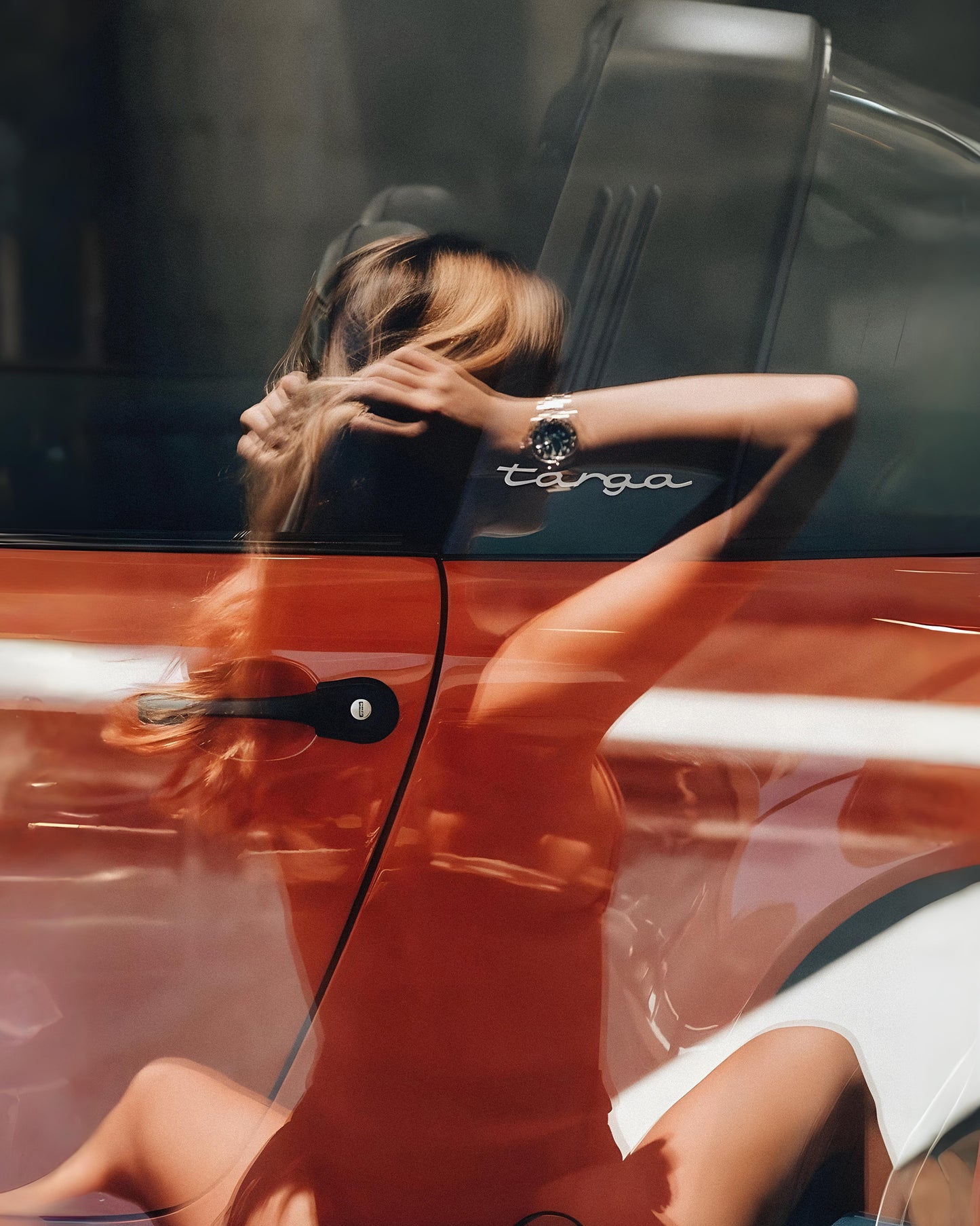 Woman's Reflection on Car