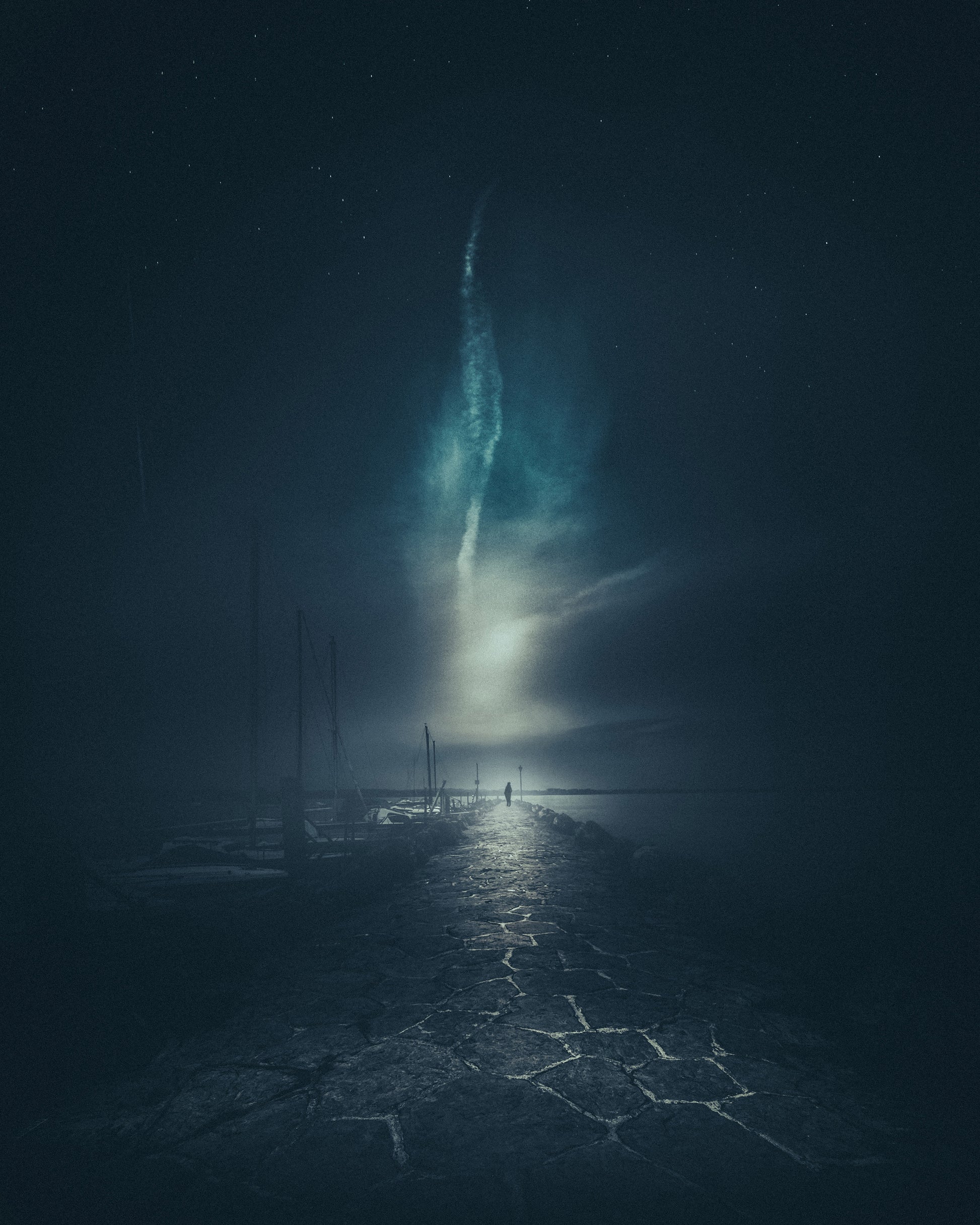 Walking Along a Stone Pier at Night
