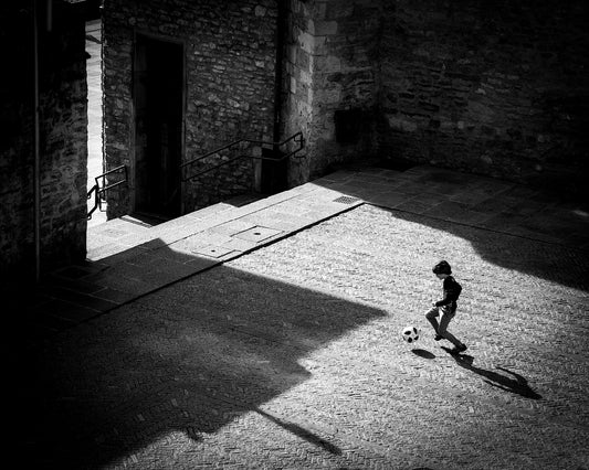 Child Playing Football