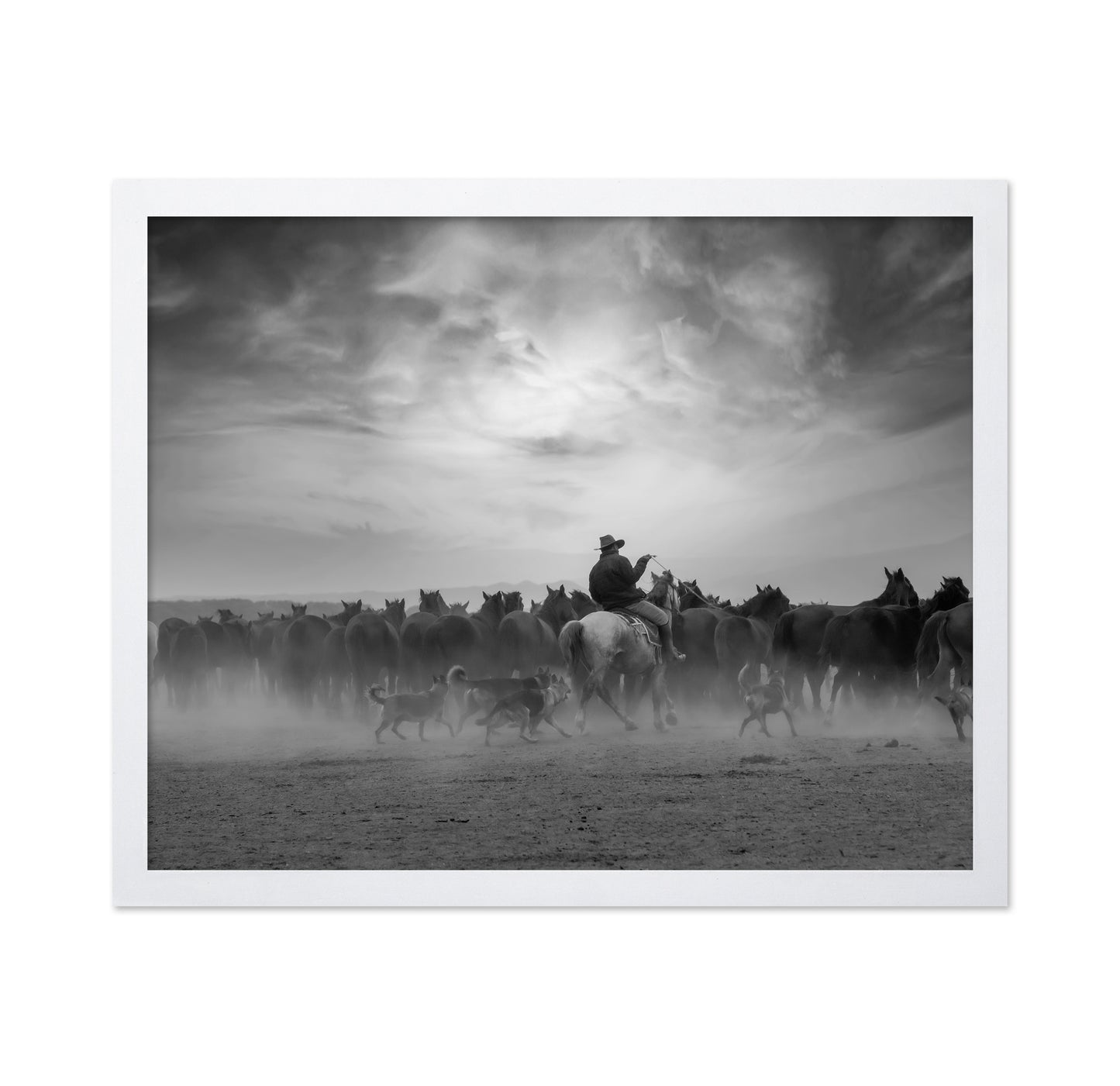 Cowboy Riding with Wild Horses
