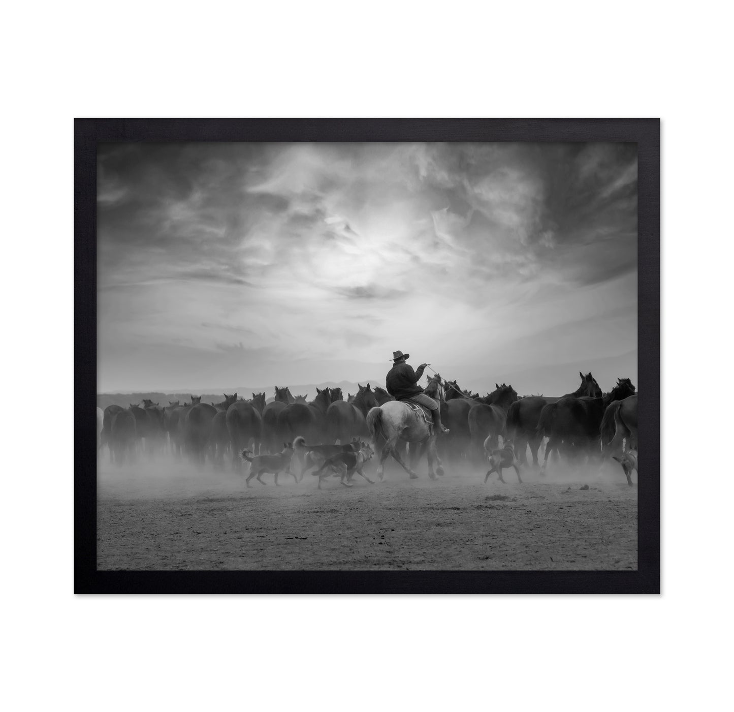 Cowboy Riding with Wild Horses