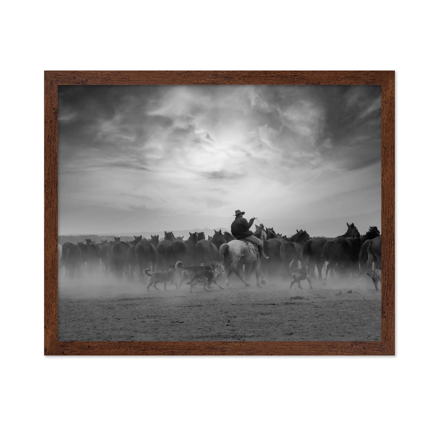 Cowboy Riding with Wild Horses
