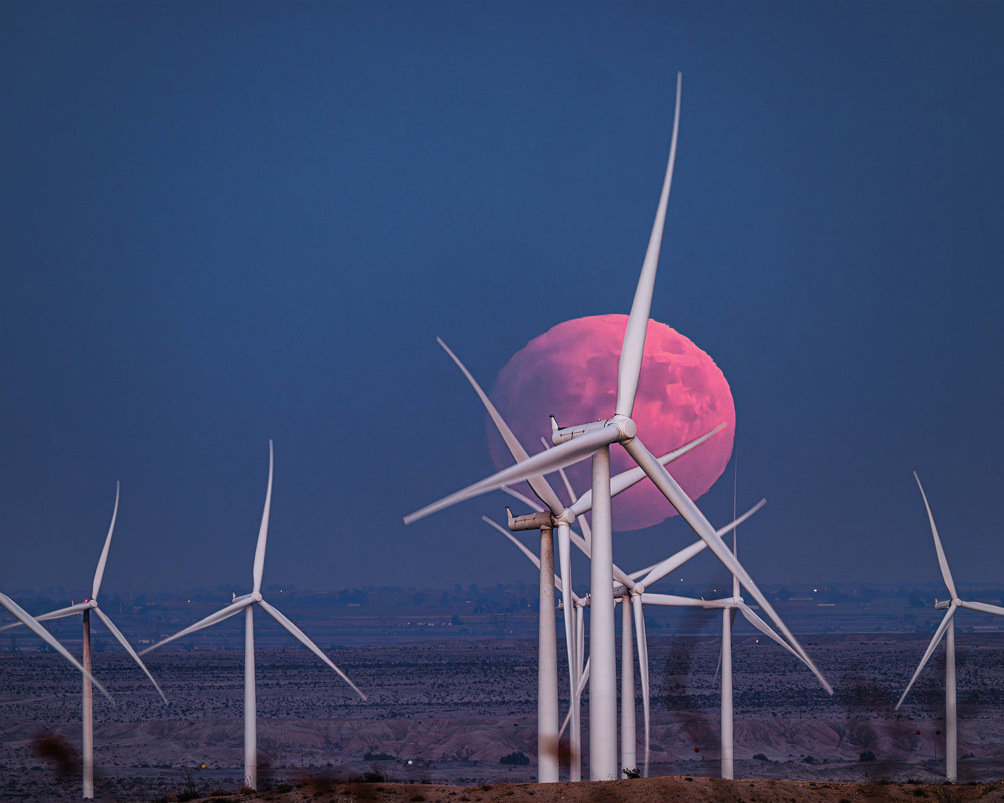 Blood Moon Rising Over a Wind Farm