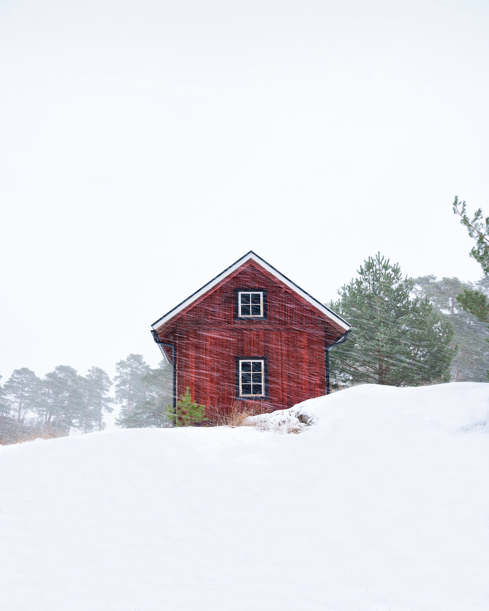 Old Red House During Snowstorm