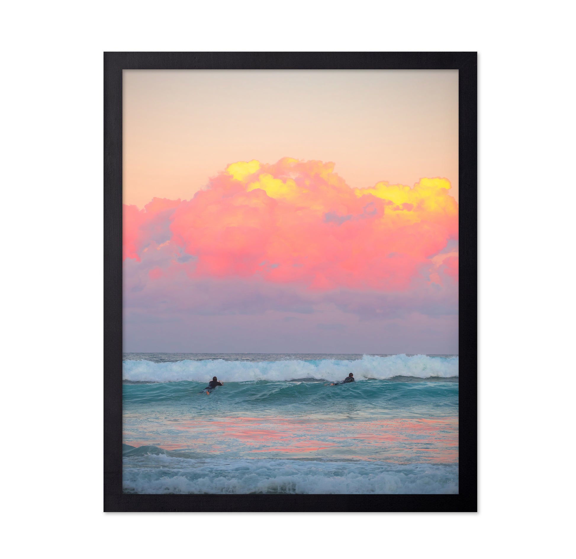 Surfers Ride The Waves At Sunset