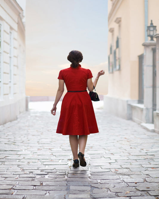 Woman in Red on Cobblestone