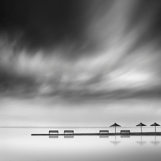 Four Benches And Three Umbrellas