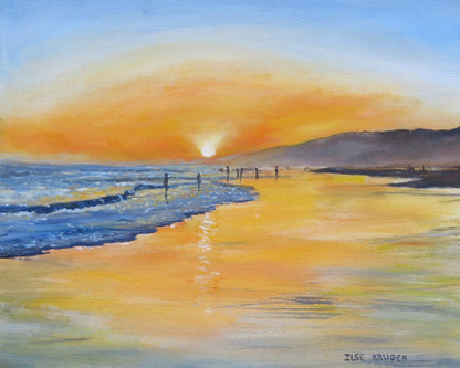 A Serene Beach Scene At Sunset
