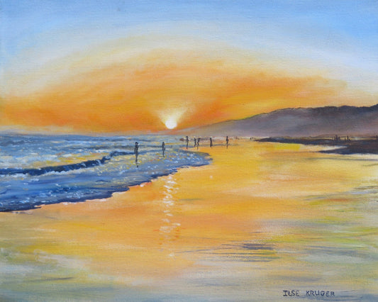 A Serene Beach Scene At Sunset