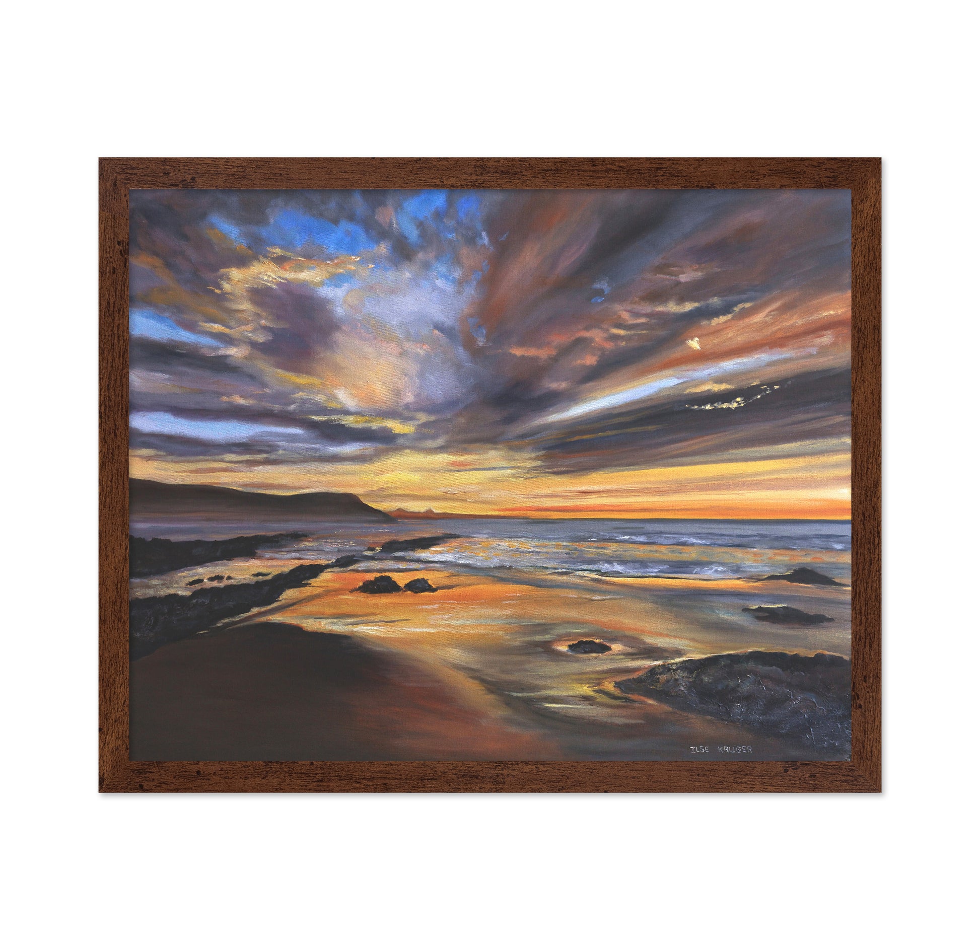 Serene Sunset Over A Rocky Beach