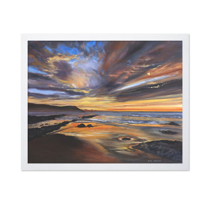 Serene Sunset Over A Rocky Beach