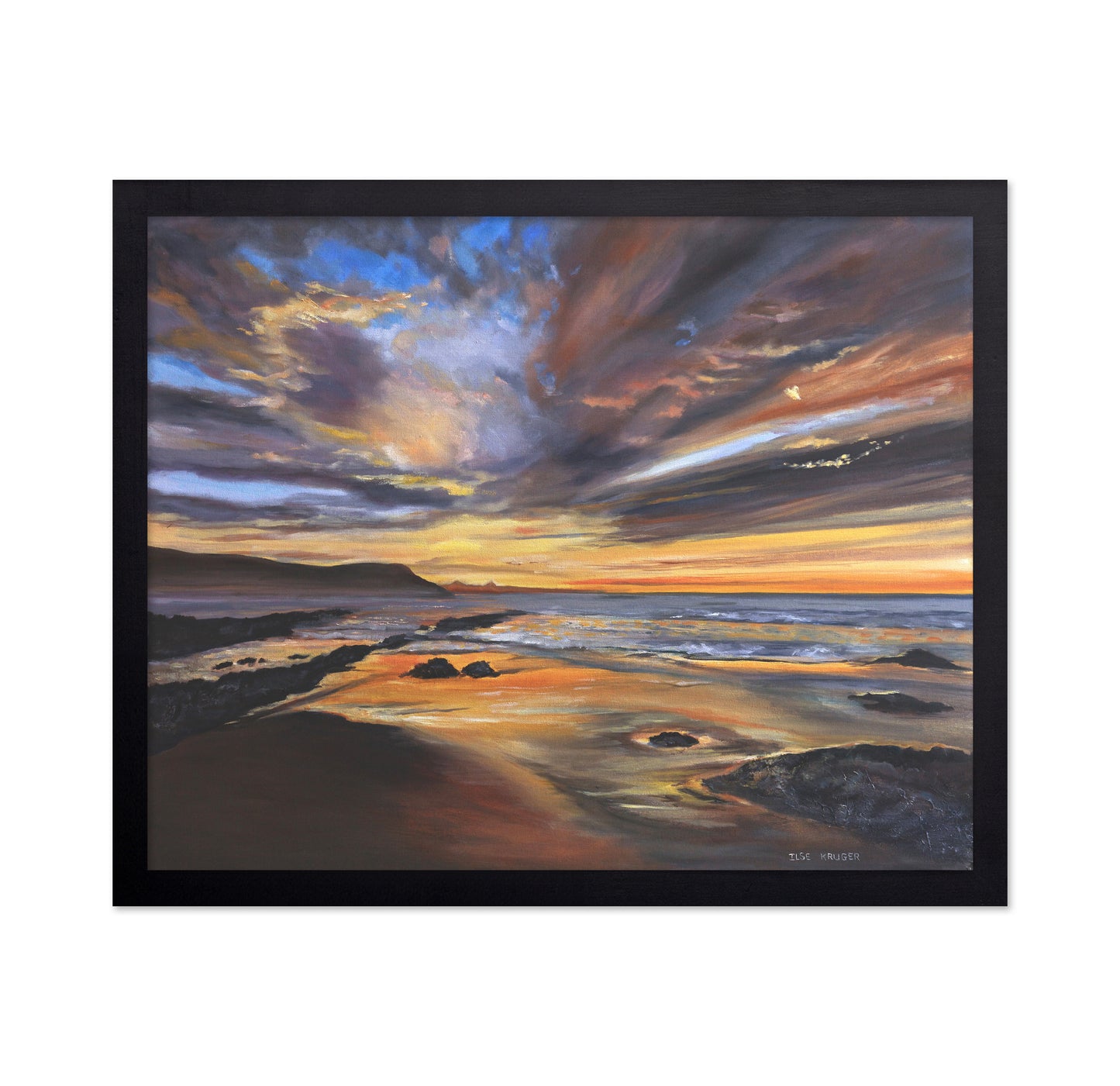 Serene Sunset Over A Rocky Beach