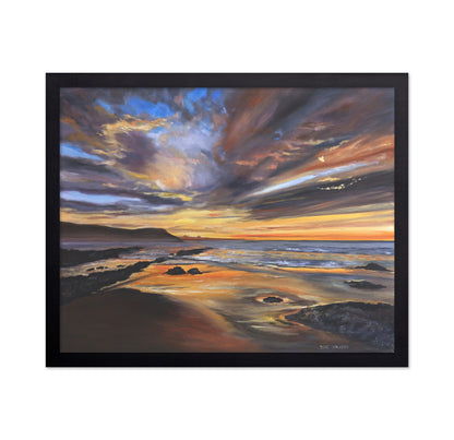 Serene Sunset Over A Rocky Beach