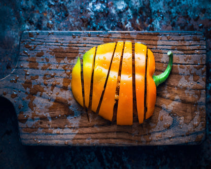 Bell Pepper On A Rustic Wooden Board