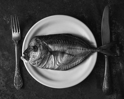 Fish On A Plate With A Fork And Knife
