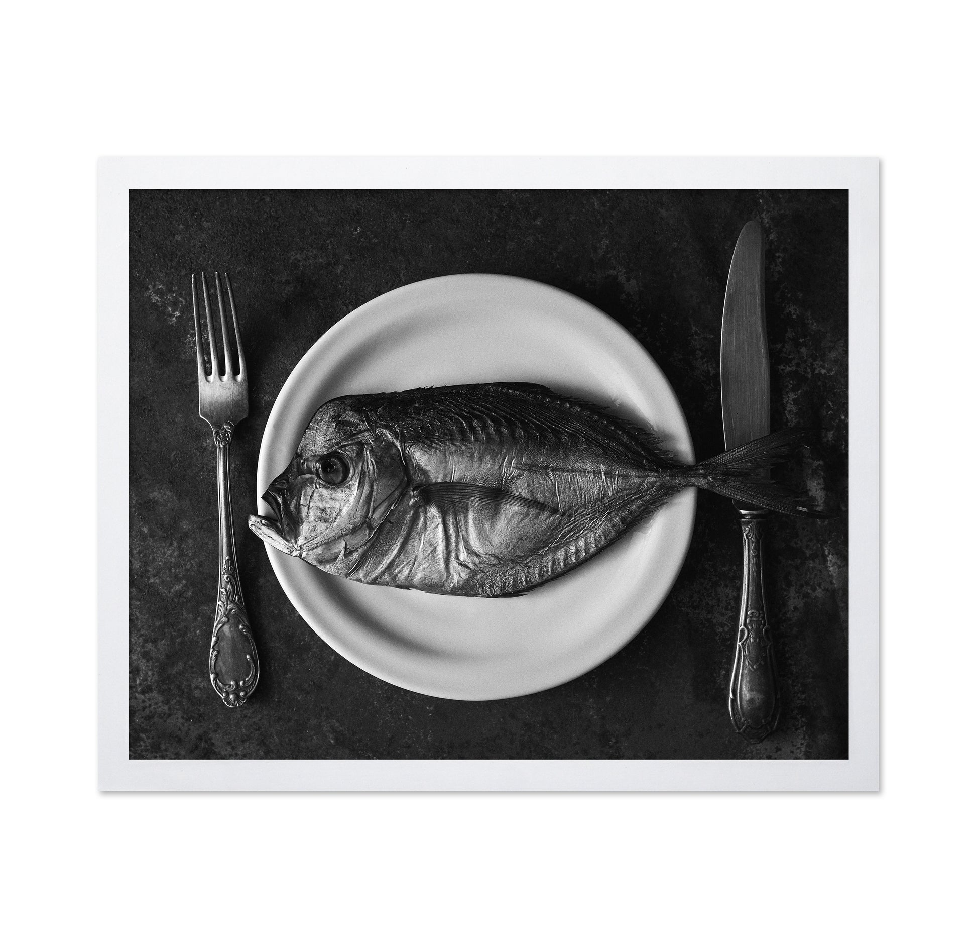 Fish On A Plate With A Fork And Knife