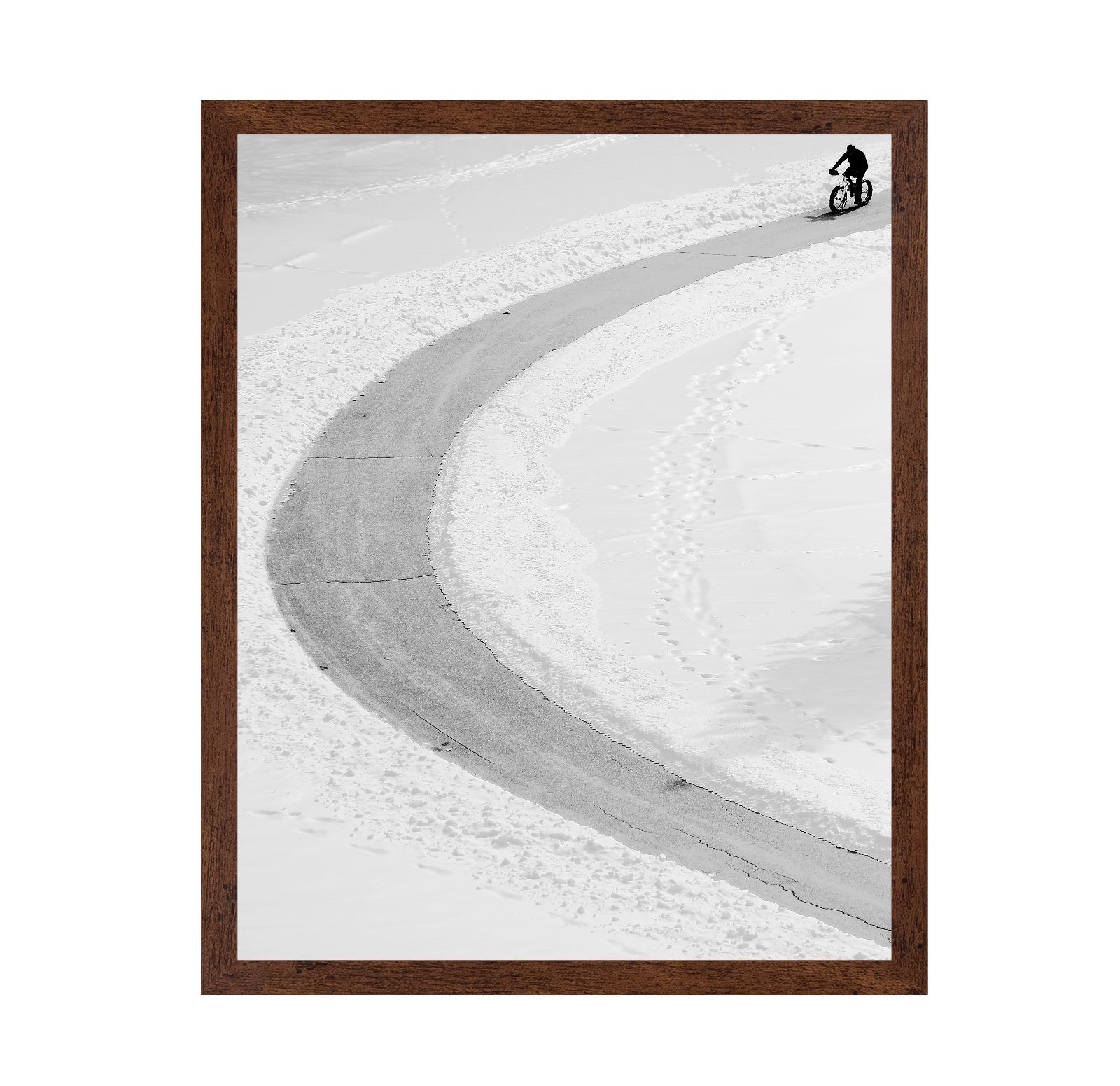 Lone Cyclist in Snow