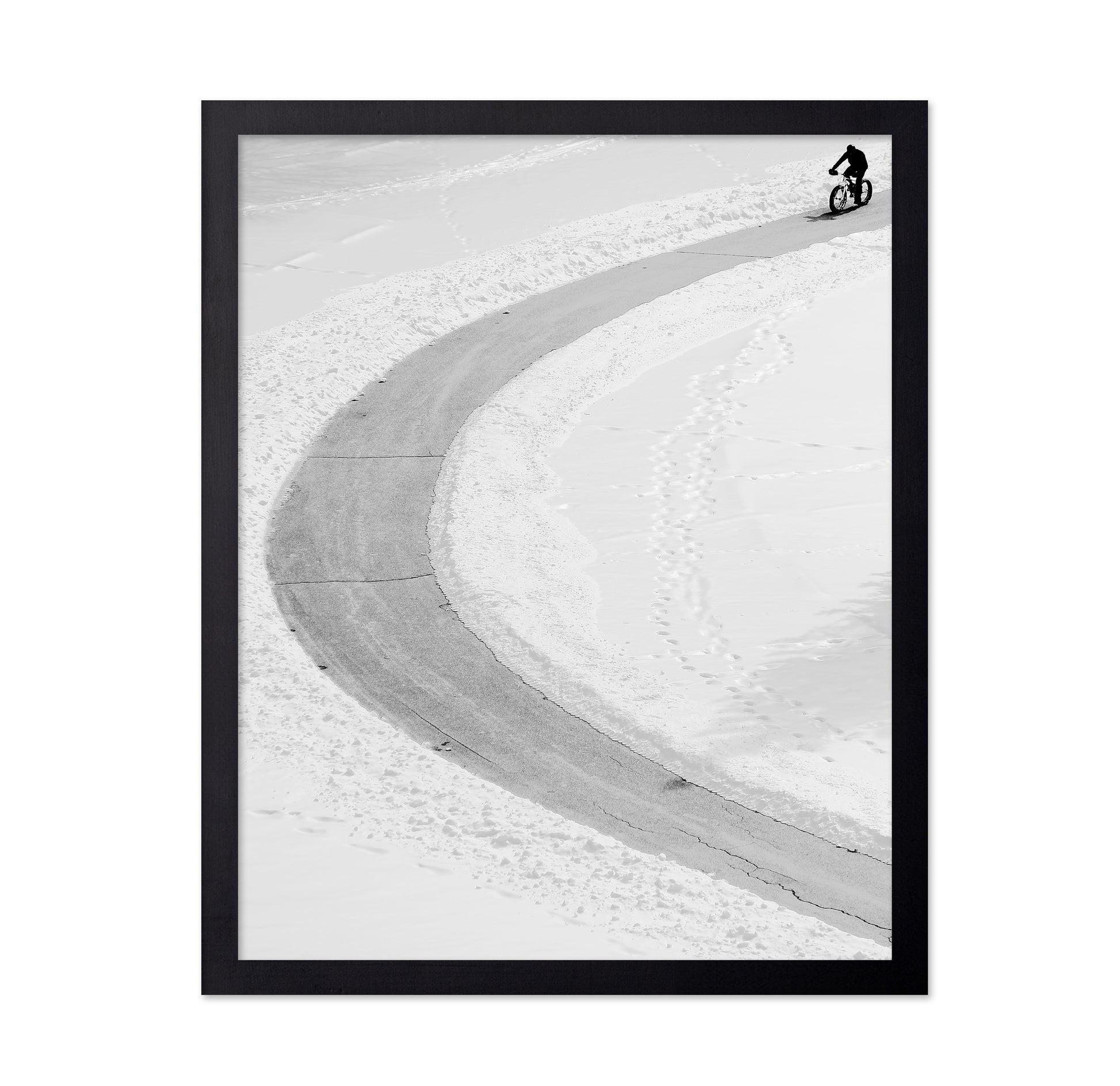 Lone Cyclist in Snow