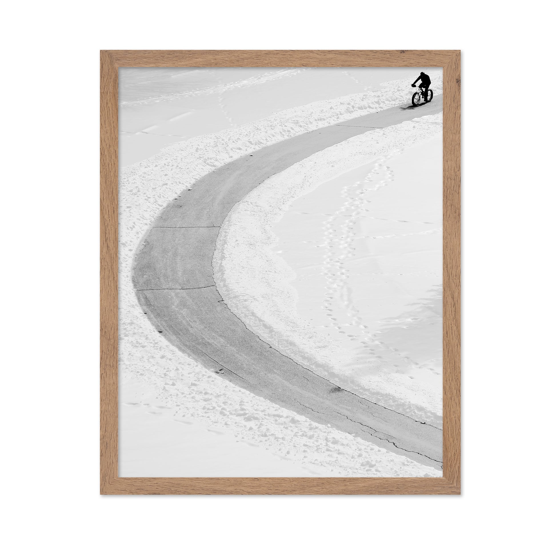 Lone Cyclist in Snow