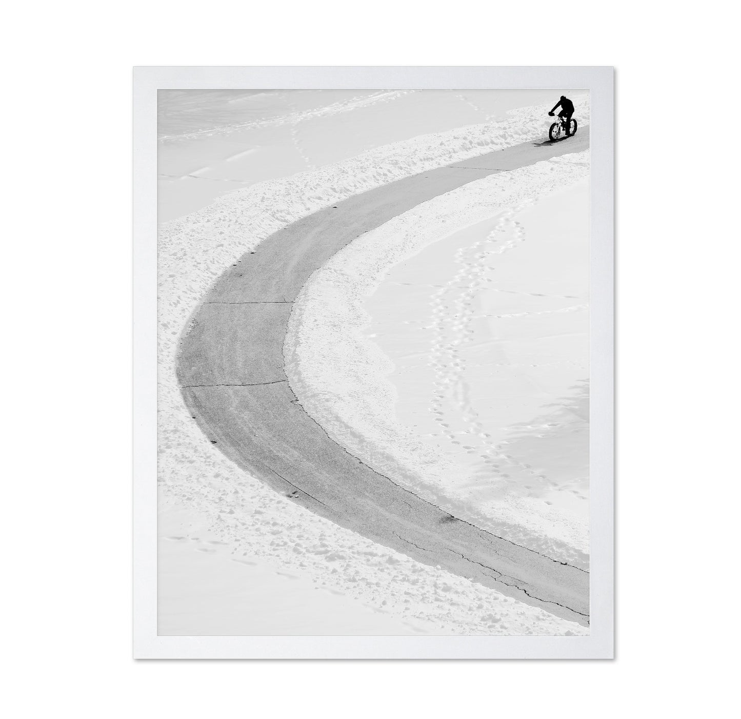Lone Cyclist in Snow
