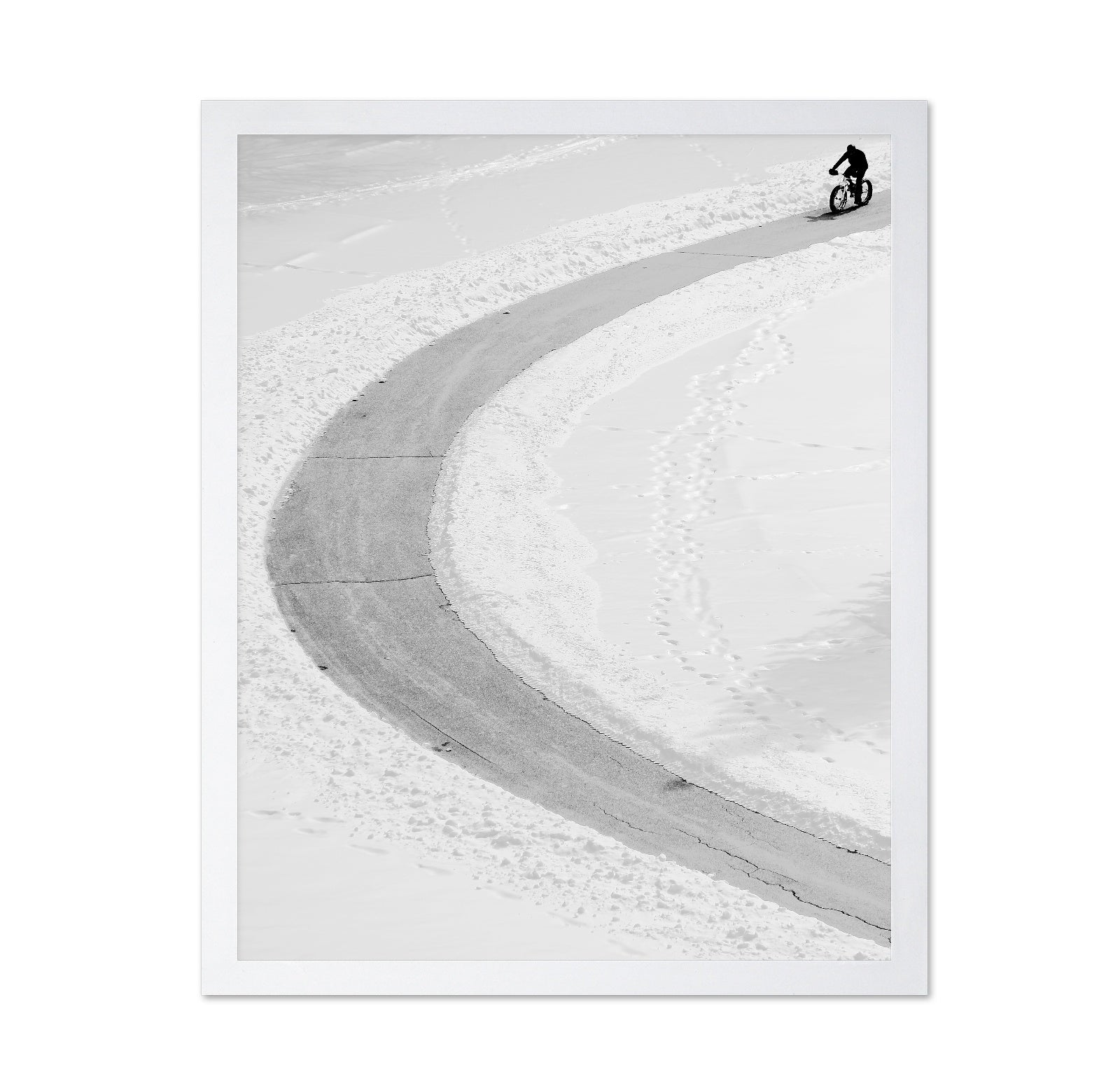 Lone Cyclist in Snow