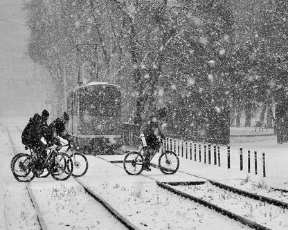 Cyclists In Snowstorm