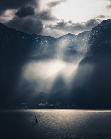Dramatic Sun Rays Over Mountain Lake