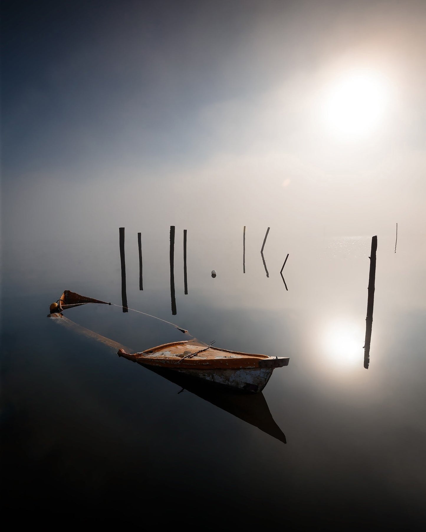 Misty Boat Reflection