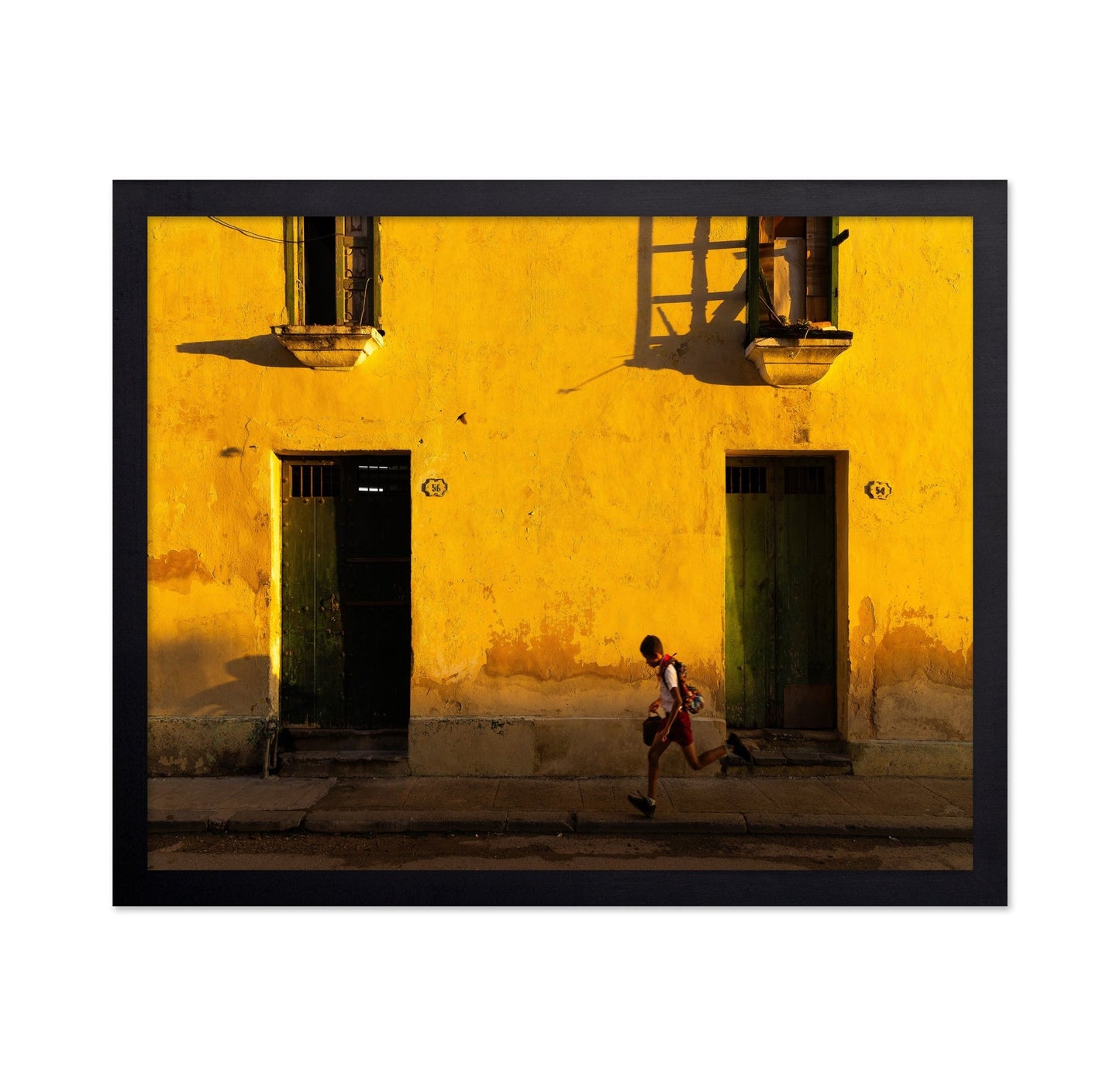 Boy Running Past Wall