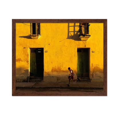 Boy Running Past Wall