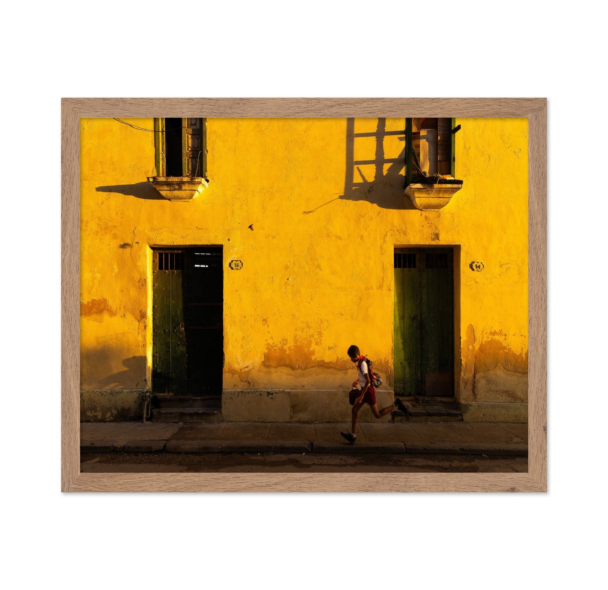Boy Running Past Wall