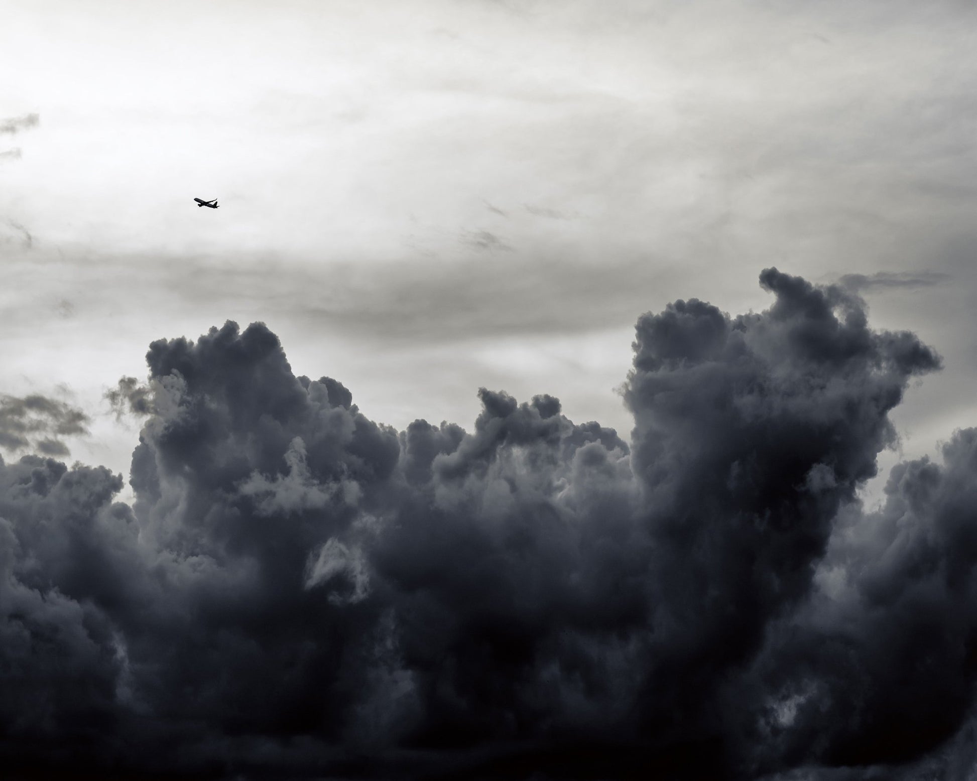 Plane Above Storm Clouds