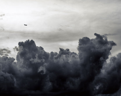 Plane Above Storm Clouds