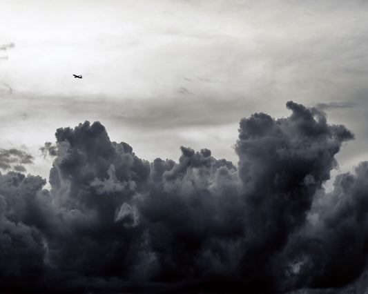 Plane Above Storm Clouds
