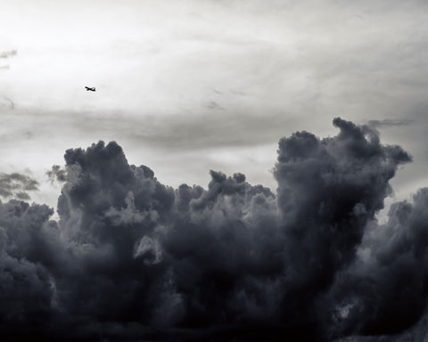 Plane Above Storm Clouds