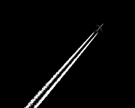 Jet Trail In Black Sky