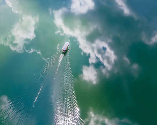 Boat Through Sky Water