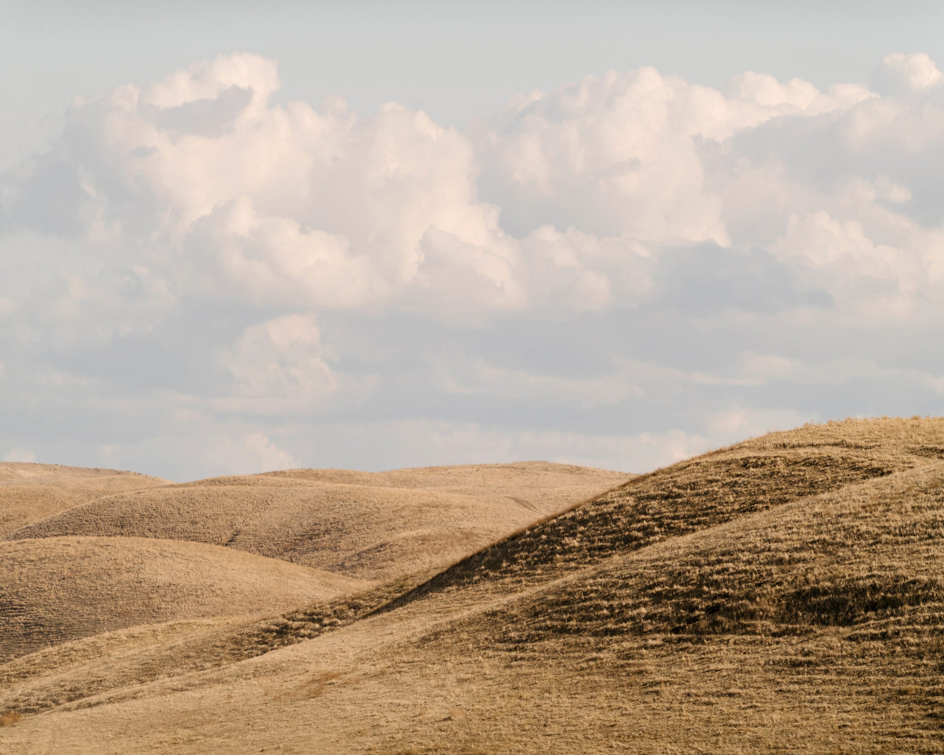 Rolling Hills Under Clouds