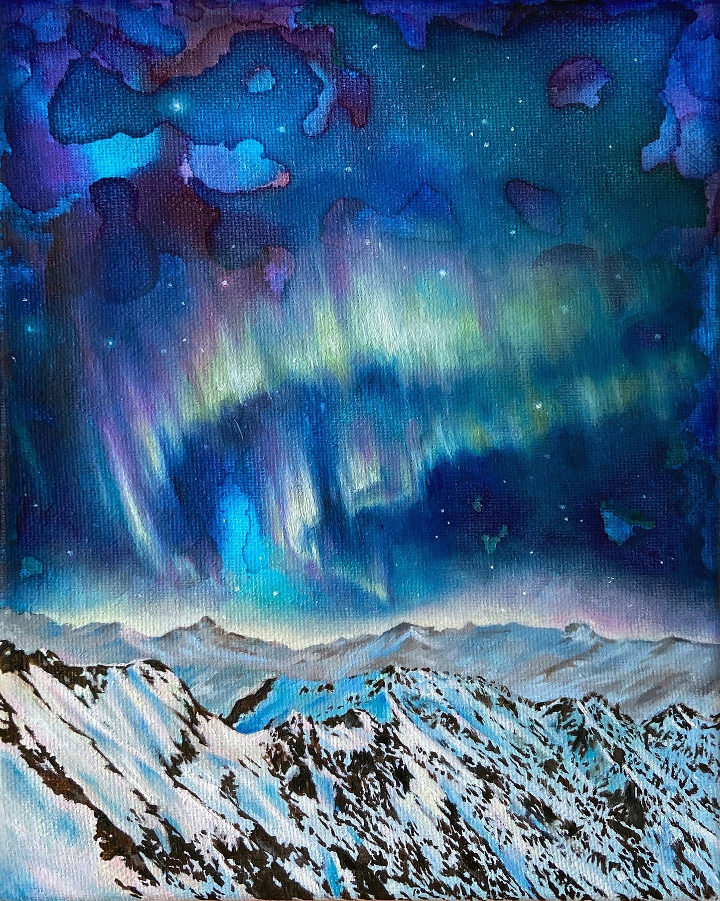 Northern Lights Over Snowy Peaks
