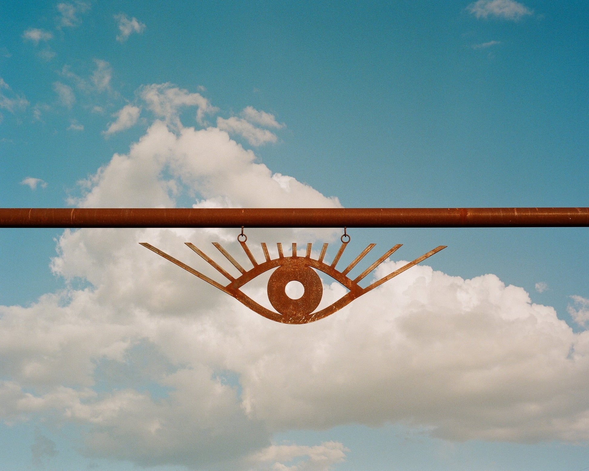 Minimalist Rust Eye Sculpture Sky